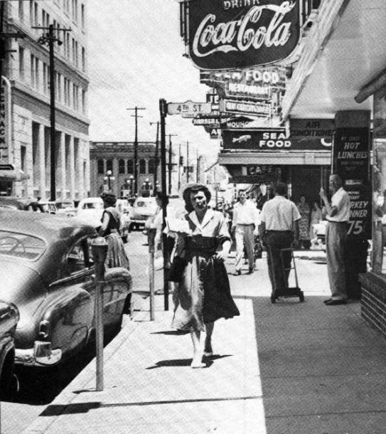 Busy scene on Murray Street, looking towards the Red River, in Alexandria, Louisiana, in the early 1950s. The city was growing, and railroads played a key element in the expansion of the area.